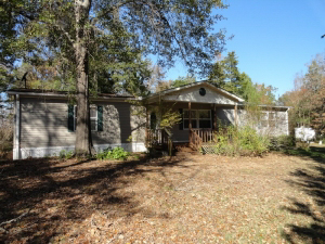 12.874 acres with a 3 bedroom, 2 bath mobile home
